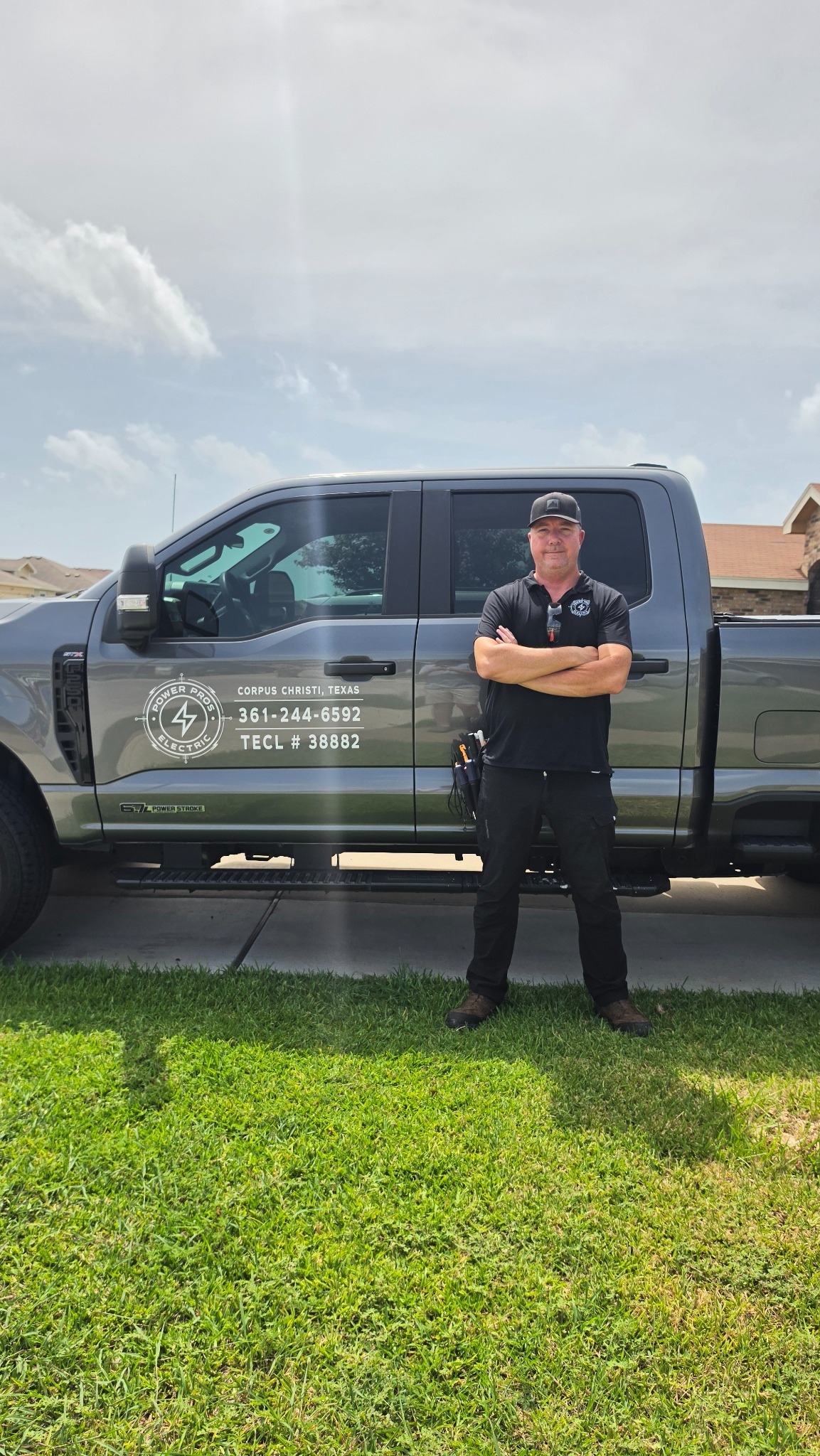 Power Pros Electric owner Erick beside the company service truck